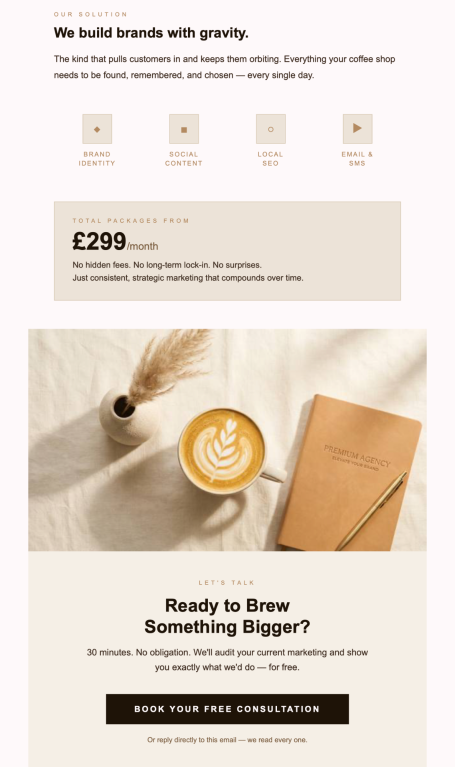 A flat white coffee beside an open notebook and a wooden pen on a light background.